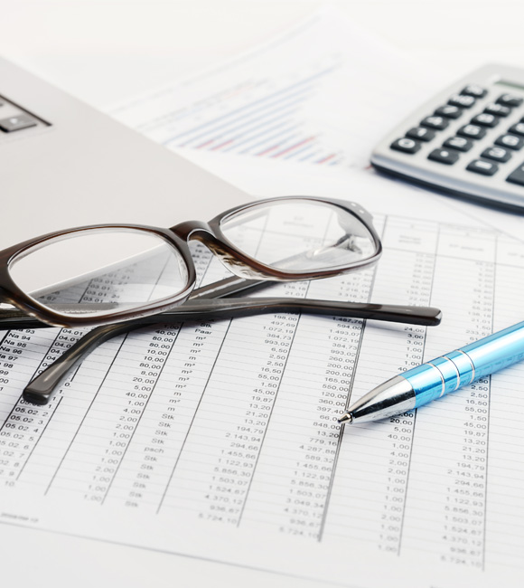 glasses and calculator on paperwork